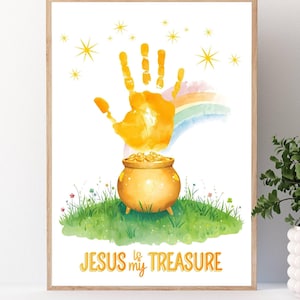 May include: A framed print featuring a handprint above a pot of gold, a rainbow, and the text "JESUS is my TREASURE." The artwork has a watercolor style with yellow, green, and blue hues, and is set against a white background.