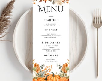 May include: A rectangular menu card with the word "MENU" at the top, featuring a fall theme. The menu lists starters, entrees, side dishes, and desserts. The bottom of the card has watercolor pumpkins and fall foliage. The card is on a white plate with a fork.