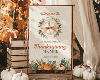 May include: Thanksgiving dinner sign with a copper frame. The sign reads "Welcome To The Moore Family's Thanksgiving Dinner" with a plate and cutlery illustration. White pumpkins and fall foliage surround the sign, creating a festive autumn scene.