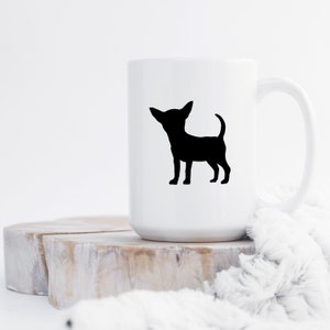 May include: White ceramic mug with a black silhouette of a chihuahua on the front.