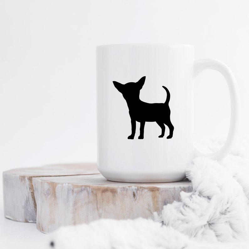 May include: White ceramic mug with a black silhouette of a chihuahua on the front.