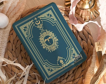 May include: A teal phone case with gold ornate detailing and a crest design. The case is personalized with the name "Sophia" in Font #1. The text "Personalize your case with your name" is visible.