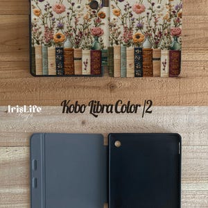 May include: A Kobo Libra Color e-reader case with a floral and book design on the outside. The inside of the case is gray and black.
