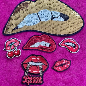 May include: A collection of six embroidered patches featuring lip designs. One large gold sequin lip patch, four red lip patches with various details including cherries, a gold chain, and text reading Pisces queen, and one small red lip patch.