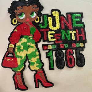 May include: Embroidered patch featuring a cartoon woman in a red jacket, green top, and camouflage pants, holding a red purse. The patch includes the text "JUNE TEENTH 1865" in sequined letters, celebrating the Juneteenth holiday.