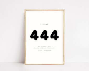 May include: A gold framed print with the text "Angel No. 444" and the message "The universe & your spiritual guides are protecting you. Clarity & decisiveness."