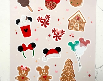Puede incluir: Una hoja de pegatinas con diseños navideños. Incluye un helado de Mickey Mouse, galletas, una casa de jengibre, bastones de caramelo y orejas de Mickey Mouse. El texto "Holidays at the Park" es visible en la parte superior.