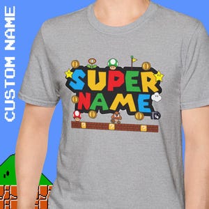 カスタムネームスーパーシャツ、ギフト、大人用Tシャツ、面白いトップス、カスタムネーム、ファミリーファッションカスタムアパレル、パーソナライズされたビデオゲームシャツ