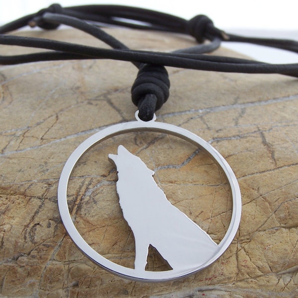 Lone wolf howling at the moon - stainless steel round pendant on natural leather mens / womens necklace