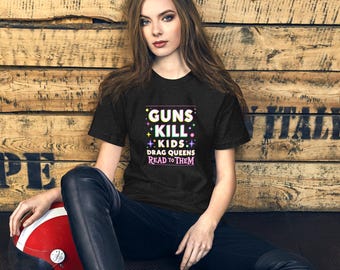Guns Kill Kids, Drag Queens Read to Them" Graphic Tee – LGBTQ+ Rights T-Shirt, Bold Political Statement Shirt, Queer Ally Gift