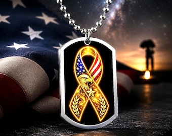 May include: A silver dog tag pendant with a patriotic ribbon design. The ribbon features the American flag and a golden eagle. The pendant hangs from a silver ball chain. The background includes an American flag and a night sky.