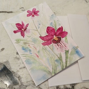 Cartão de felicitações em branco com orquídea aquarela Oncidopsis Onolicious 'Vivid'