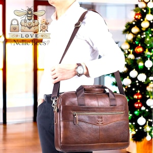 May include: A brown leather briefcase with a shoulder strap. The briefcase has a zippered pocket and a metal buckle.