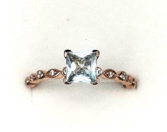 Elegant Princess-Cut Aquamarine solitaire Ring in Rose Gold Plated Silver with Pave Accents