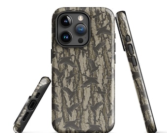 May include: A protective phone case featuring a camouflage pattern with dark brown tree bark textures and silhouettes of flying ducks. The case is shown from three angles, displaying the camera cutout, side buttons, and bottom charging port.