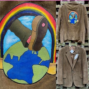 May include: Brown corduroy blazer with a colorful patch featuring a boot stepping on a globe under a rainbow. The back of the jacket has a similar patch. Another blazer has a lightning bolt design.