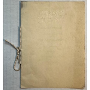 May include: A blank menu with a decorative border and the word "MENU" printed in a vintage font.