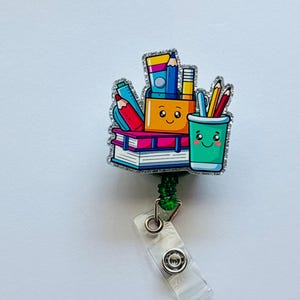 Carretel de distintivos com tema escolar
