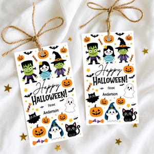 May include: Two rectangular white gift tags with brown twine bows, featuring colorful Halloween illustrations of Frankenstein, a witch, ghosts, black cats, bats, and pumpkins. The text reads Happy HALLOWEEN! FROM: Anderson in black ink.