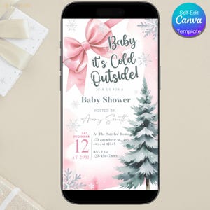 K&ouml;nnte beinhalten: Ein Smartphone zeigt eine Babyparty-Einladung. Das Design zeigt eine rosa Schleife, Schneeflocken und einen Aquarell-Tannenbaum. Der Text lautet "Baby it's Cold Outside!" und enth&auml;lt Eventdetails.