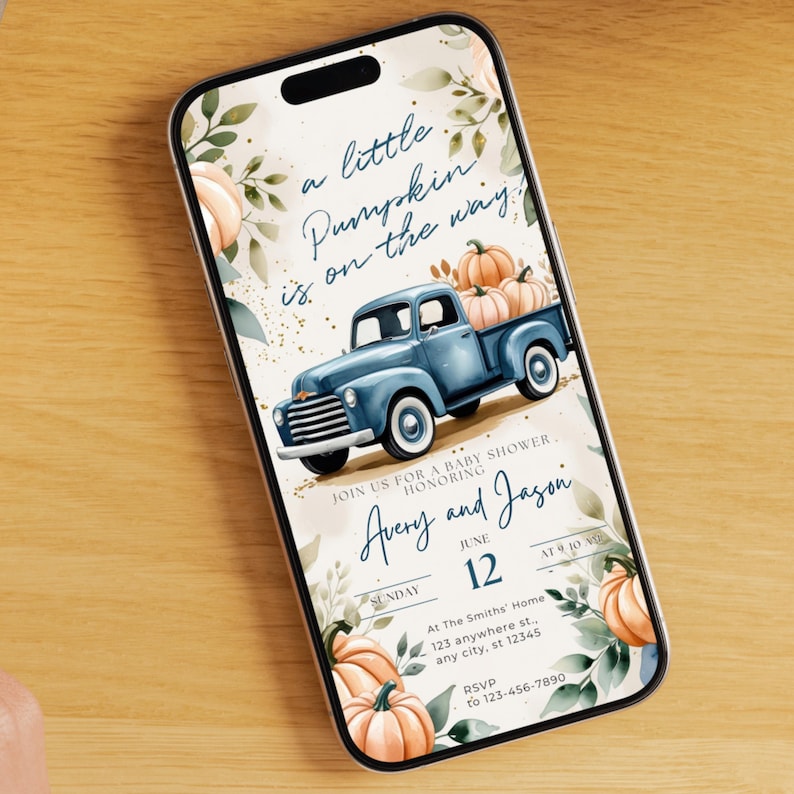 May include: A baby shower invitation displayed on a smartphone. The design features a blue vintage truck carrying pumpkins, with text that reads "a little Pumpkin is on the way." The invitation is for Avery and Jason, with the date June 12.