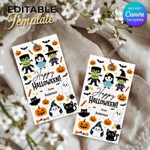 May include: Two rectangular white gift tags featuring a colorful Halloween pattern with pumpkins, ghosts, bats, black cats, and cartoon characters. The text reads Happy Halloween! and From: Anderson. Each tag has a hole at the top with a grey string.