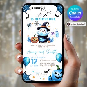 May include: A Halloween-themed baby shower invitation on a smartphone screen. The design features a ghost in a witch hat, pumpkins, and the text "A Little Boo Is Almost Due." The invitation includes the names Avery and Smith, date, time, and RSVP information.
