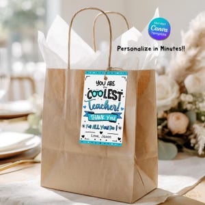 May include: A brown paper gift bag with white tissue paper and a tag that reads "You are the Coolest Teacher! Thank You". The tag has blue accents and the text "Personalise in Minutes!!".