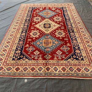 Handmade Afghan Kazak Rug: 6x9 Red Wool Geometric Carpet