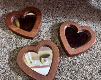 Set of three vintage wood framed heart shaped mirrors