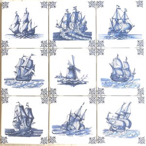 May include: Nine square ceramic tiles with blue and white illustrations of sailing ships and a windmill. Each tile features a different ship design or a windmill scene, with decorative corner accents.