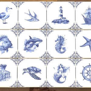 May include: A set of twelve square ceramic tiles arranged in a grid, each featuring a blue and white nautical illustration. Designs include a seagull, bird, lighthouse, ship, fish, whale, seahorse, starfish, treasure chest, turtle, mermaid, and wheel.