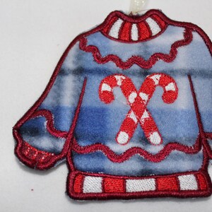 Hässliche Pullover-Ornament-Zuckerstange