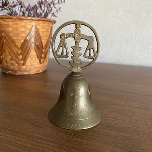 Antique handmade bronze libra zodiac bell-Bronze tabletop bell from the 1940s