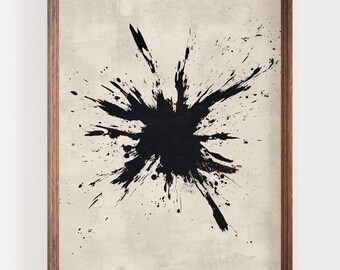 May include: Abstract art print featuring a large black ink splatter design on a beige background. The artwork is framed in a natural wood frame, adding a touch of warmth to the piece. The bold contrast makes it a striking wall decor.