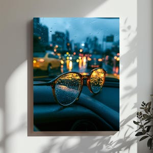 May include: A pair of brown-rimmed glasses resting on a dark dashboard, featuring lenses covered in raindrops. The background shows a blurred city street at night with yellow taxi lights and bokeh street lamps through a wet windshield.