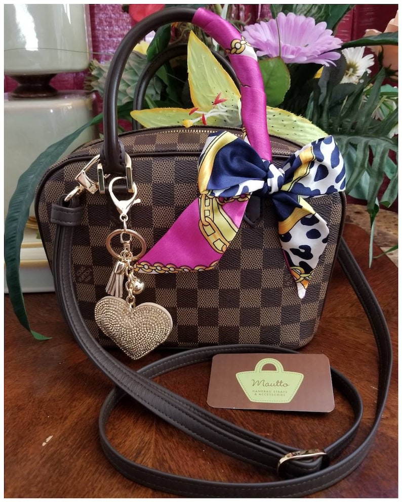 Photo from a customer showing their DE strap attached to their LV handbag.