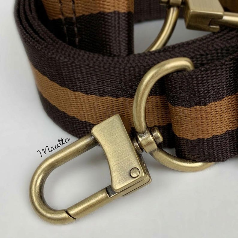 Brown and tan striped strap shown with aged/brushed gold hardware finish.