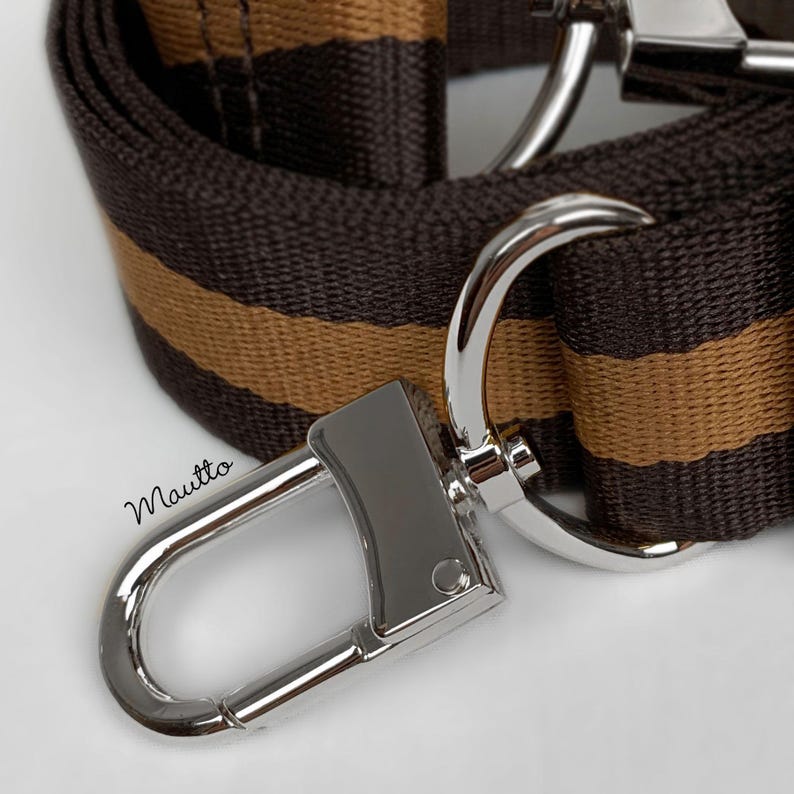 Brown and tan striped strap shown with silver hardware finish.