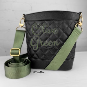 Photo of olive green woven purse strap on purse. Adjustable shoulder to cross body length.