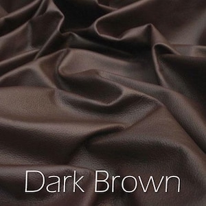Photo of dark brown genuine leather hide.