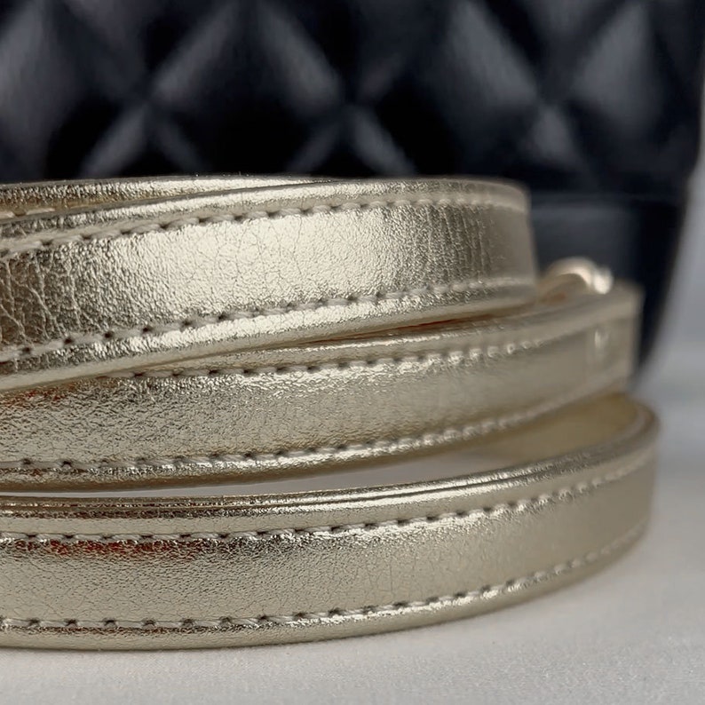 Close-up view of Light Gold / Champagne metallic leather strap.