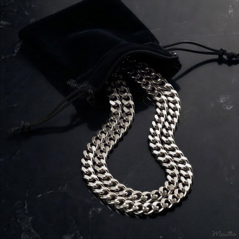 Polished silver fancy link chain strap for bags, purses, clutches, night out bags, handbags, cell phone cases, necklaces and more. Shown on display with a black storage pouch / dust bag.