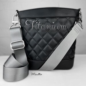 Photo of silver gray woven purse strap on purse. Adjustable shoulder to cross body length.