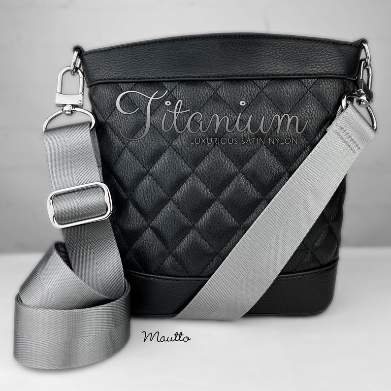 Photo of silver gray woven purse strap on purse. Adjustable shoulder to cross body length.
