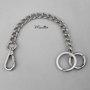 Luxury chain key fob tether and handbag accessory. Attachable clip and keyring / o-ring accessory, to secure your keys to your bag or clothing. Jewelry quality metal chain. Made by hand in the USA. Silver-tone finish shown.