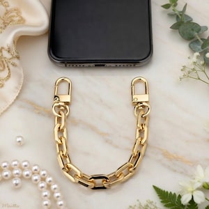 Kedjetelefonarmband eller grepphandtag - Lyxiga godisasklänkar