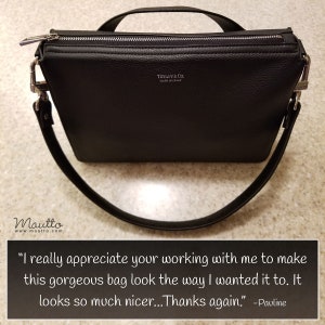 Photo of short shoulder strap on a purse.