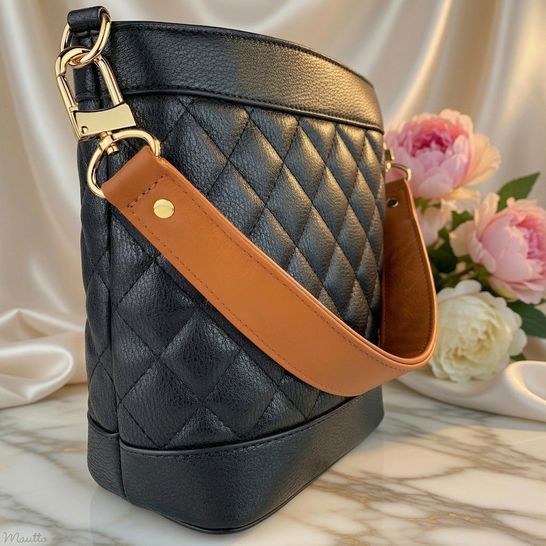 Tapered width short shoulder or crook of arm strap. Choice of genuine leather and clip/hook style. Shown in Dark Tan leather with gold hardware on a black bag.