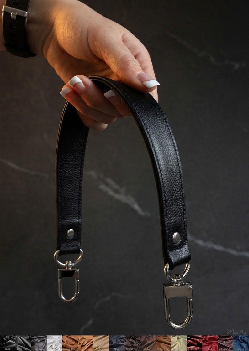 Tapered width short shoulder or crook of arm strap. Choice of genuine leather and clip/hook style. Shown with silver hardware.